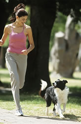 woman jogging with dog